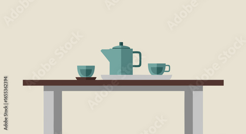 Tranquil Table Tea Set: A minimalist image portrays a tea set on a table. Teal ceramic teapot and cups on a brown wooden table are arranged, offering a glimpse into serenity