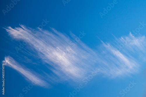 Whisp Of Cloud Smears Across Blue Sky