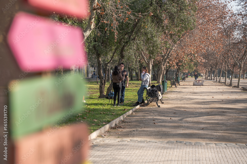 Naklejka premium people riding bikes in park