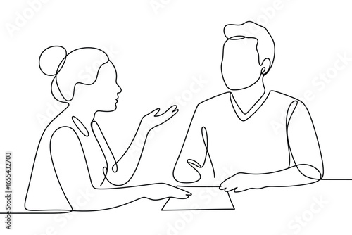 Two people in a meeting discussing a document