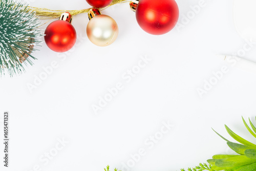 A white background with a bunch of red and gold Christmas ornaments