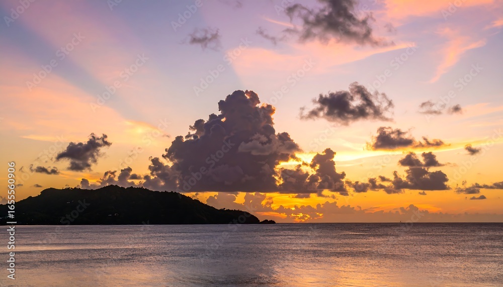 Fototapeta premium Dramatic sunset over a calm ocean