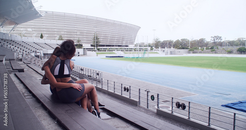 Canvas Print Woman, athlete and hug at stadium for sports, team building and motivation for international contest