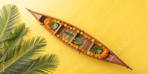 Traditional Vallamkali boat race during the auspicious festival of Onam celebrations decorated with marigold flowers and leaves