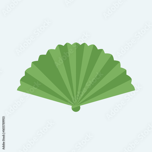 A green folding fan against a light blue background.