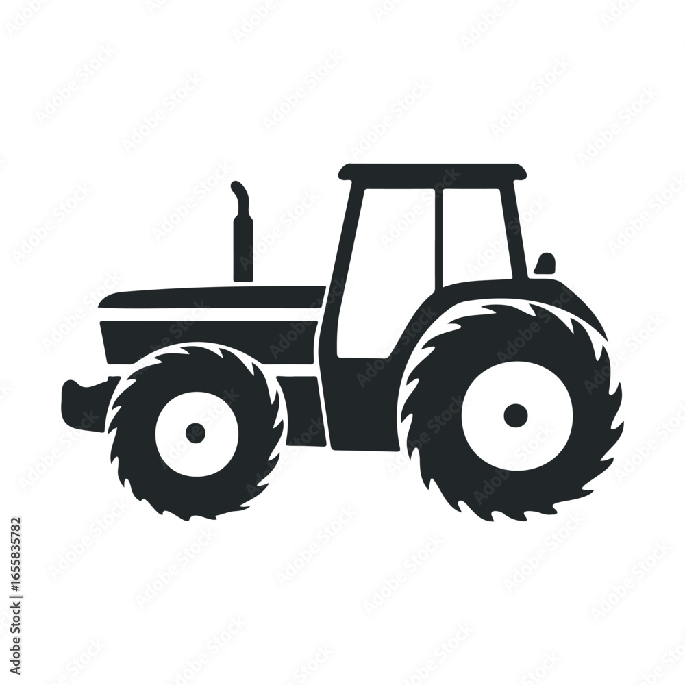 Obraz premium Silhouette of a classic farm tractor with large tires