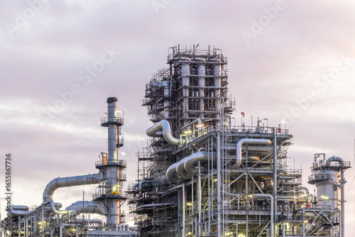 Wallpaper Mural Oil and Gas refinery petrochemical plant industrial on sunset background, Oil and Gas refinery petrochemical plant pipeline steel, Oil and Gas refinery factory maintenance, Global energy refinery. Torontodigital.ca