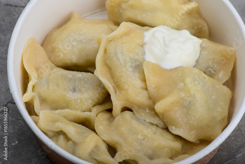 dumplings with liver and sour cream in disposable dishes