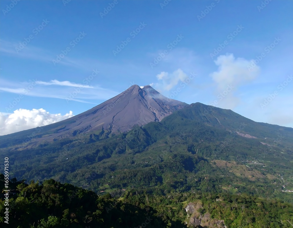 Fototapeta premium Volcanic mountain peak with smoke