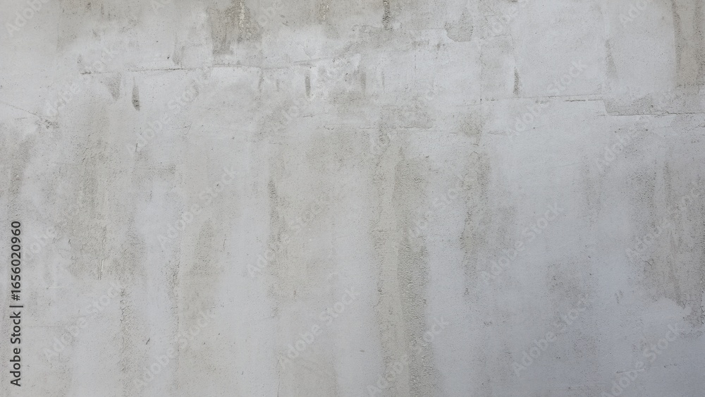 Fototapeta premium Old grey concrete wall with stains, uneven color, building wall, house, shop, building wall texture image.