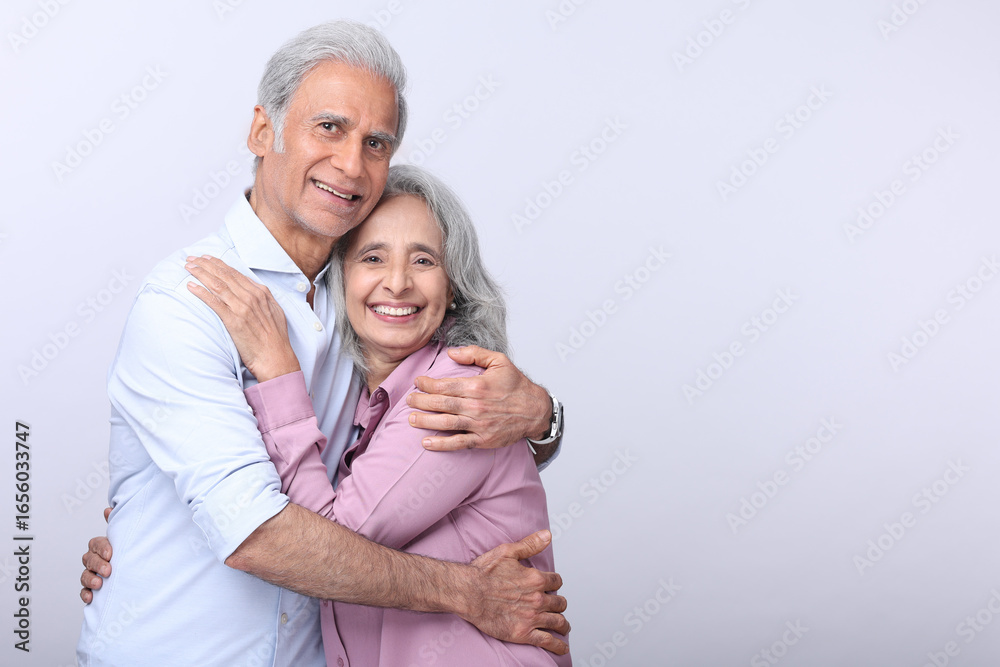 Mature Husband And Wife Sharing A Warm Embrace In A Neutral Setting Mature Husband And Wife Sharing A Warm Embrace In A Neutral Setting