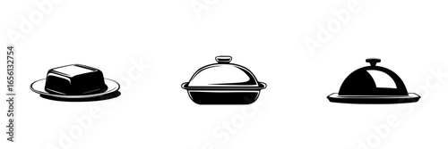Elegant serving dishes displayed on a table, showcasing different styles of food presentation in a modern dining setting