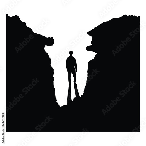 Lone figure in a mountain pass silhouette
