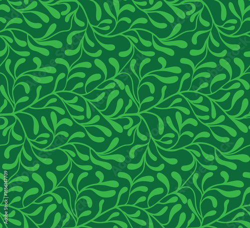 Seamless green foliage pattern varying shades of green leaves against a deep green background.

