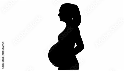 Silhouette of a pregnant woman in profile with hands resting on her belly in a black and white image