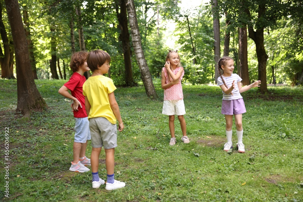 Obraz premium Cute little kids having fun together in park
