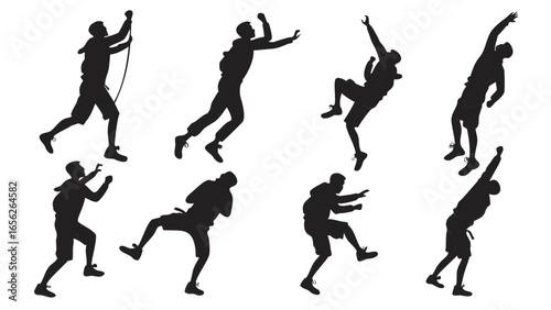 Silhouette of a man climbing a rock