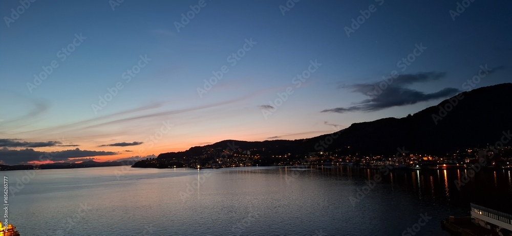 Fototapeta premium invergordon united kingdom Serene Sunset View Over Coastal Town With Calm Waters