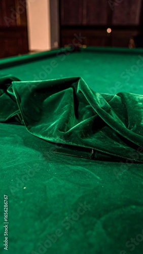 Pool table's draped green felt