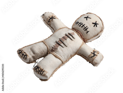 Handmade burlap voodoo doll with stitched eyes and mouth twine bindings and metal staples on its chest.