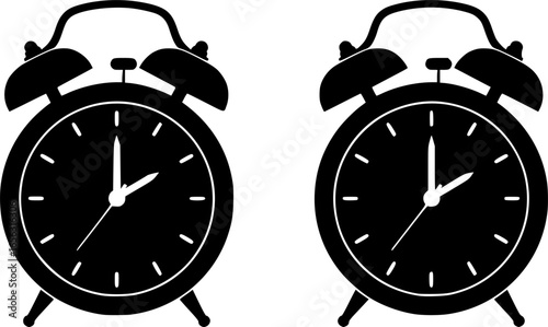 Two classic alarm clocks side by side
