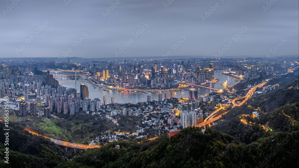 Obraz premium Aerial view of Chongqing China at night with magical city lights and river reflections creating breathtaking urban nightscape