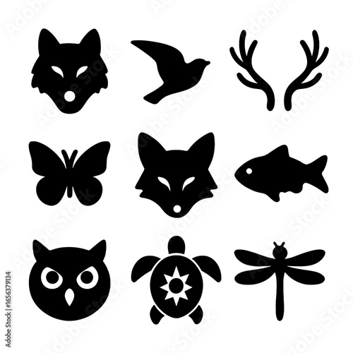 Animal Tattoo Icons. Solid, filled icon set of Animal-themed tattoos: wolf head, bird in flight, deer antlers, butterfly, fox face