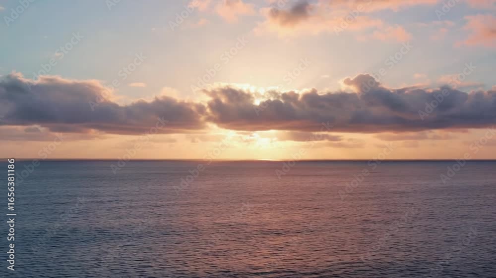 Sunset over calm ocean