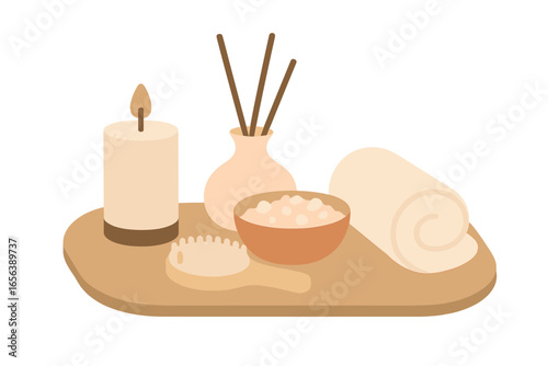Spa items with candle and rolled towel