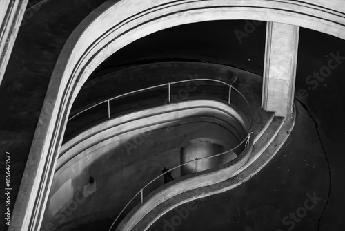 Monochrome depiction of an architectural structure showcasing smooth curves and a minimalist design.