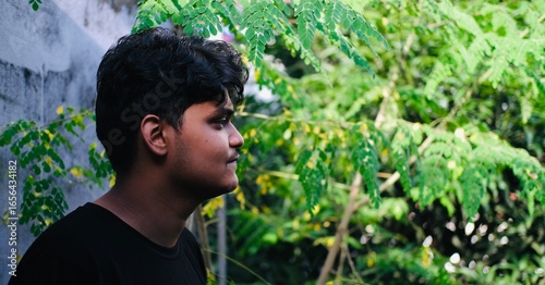 Young men portrait with nature background