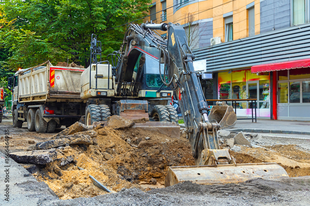 Fototapeta premium Construction site with modern machines on urban city street