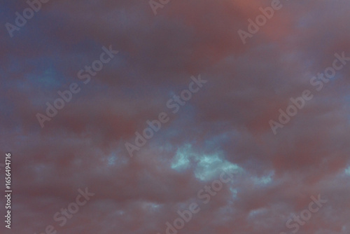The amazing color of the evening sky and the pattern of clouds on it.