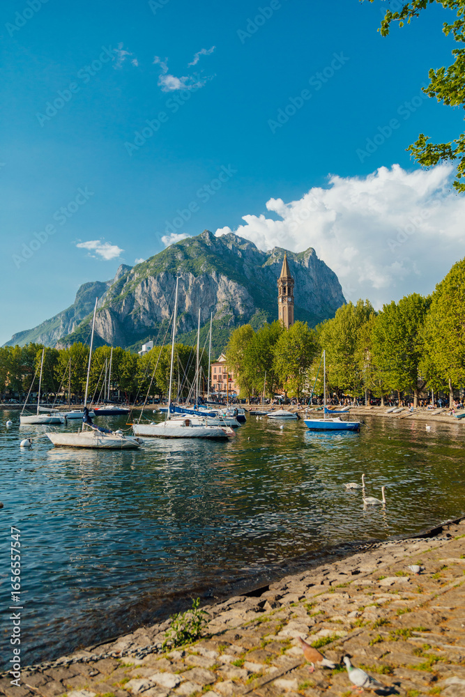 Fototapeta premium Sailboats docked on Lake Como in Lecco, Italy