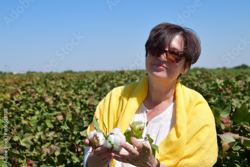 Woman in cotton field. Uzbekistan