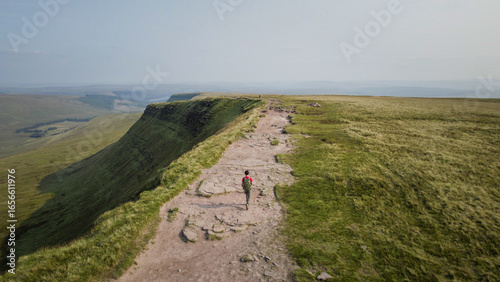 Backpacker hiking in Bannau Brycheiniog National Park, Brecon Beacons in South Wales