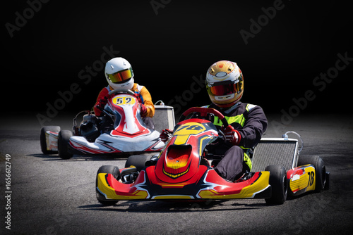 Two Go-Kart Racers on a Track, Isolated on a Dark Background