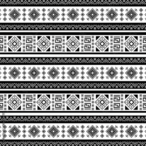 Bold black and white tribal geometric pattern with intricate diamond and linear motifs