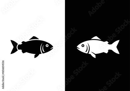 Fish Silhouette: A monochromatic image showcasing two fish silhouettes, one white against black, the other black against white, each representing a fish against contrasting backgrounds.