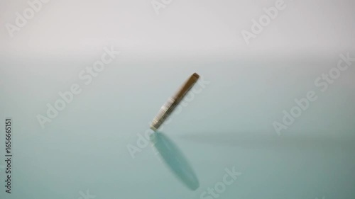 Financial concept: spinning 1€ coin on light background