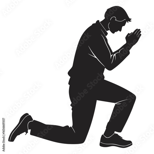Silhouette of a man kneeling in prayer