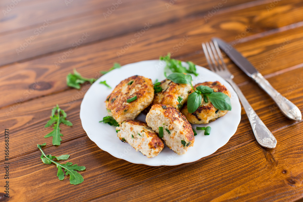 Chicken cutlets with a crispy crust on a wooden table Chicken cutlets with a crispy crust on a wooden table