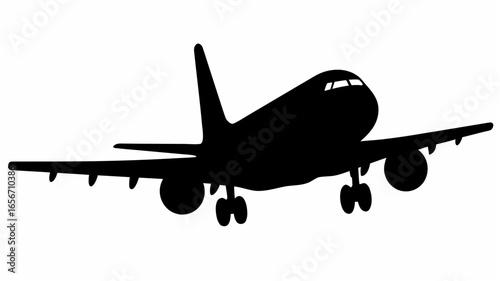 Silhouette of a passenger airplane with landing gear extended preparing to land on the runway strip