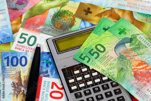 This is a scientific calculator with Swiss francs nearby