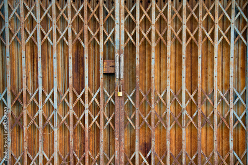 2. Vintage and rusty expandable steel gate with classic folding design