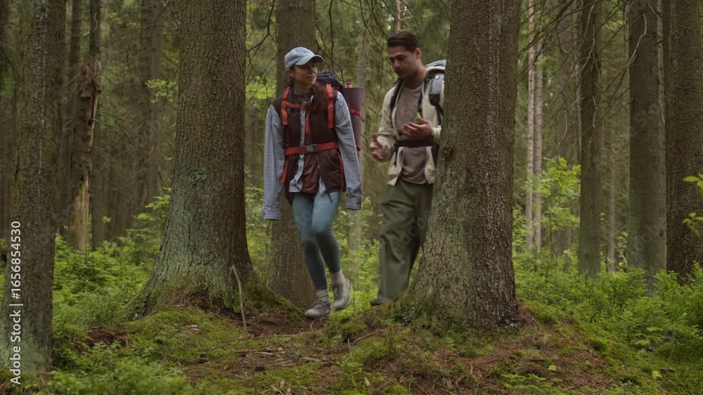 custom made wallpaper toronto digitalLong shot of intercultural young boyfriend and girlfriend in hiking clothes exploring forest trails and chatting