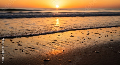 Wallpaper Mural Golden sunrise on a beach.  Soft waves lap at the shore Torontodigital.ca