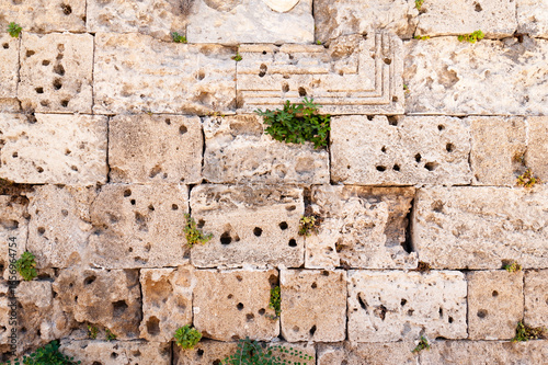 background in the form of a stone wall made of large sand blocks