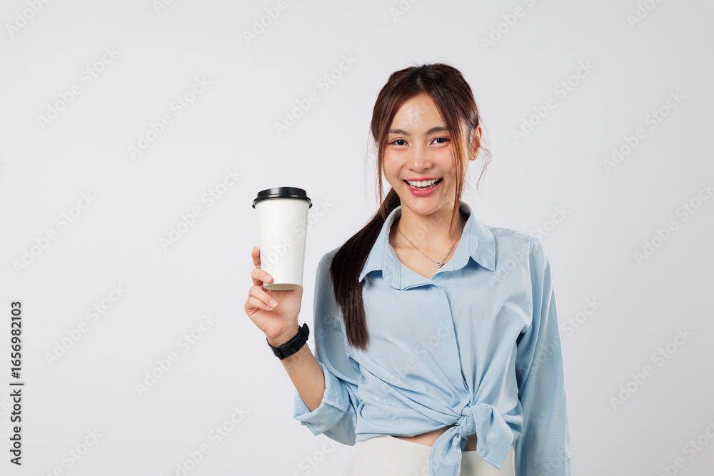 Coffee in a paper cup held by happy Asian woman in casual style, enjoying takeaway coffee during work break, showing smile and joy in cafe or tea time setting. isolated studio white background Coffee in a paper cup held by happy Asian woman in casual style, enjoying takeaway coffee during work break, showing smile and joy in cafe or tea time setting. isolated studio white background