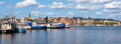 Photography Scenic Waterfront View with Boats and Colorful Buildings of Stockholm